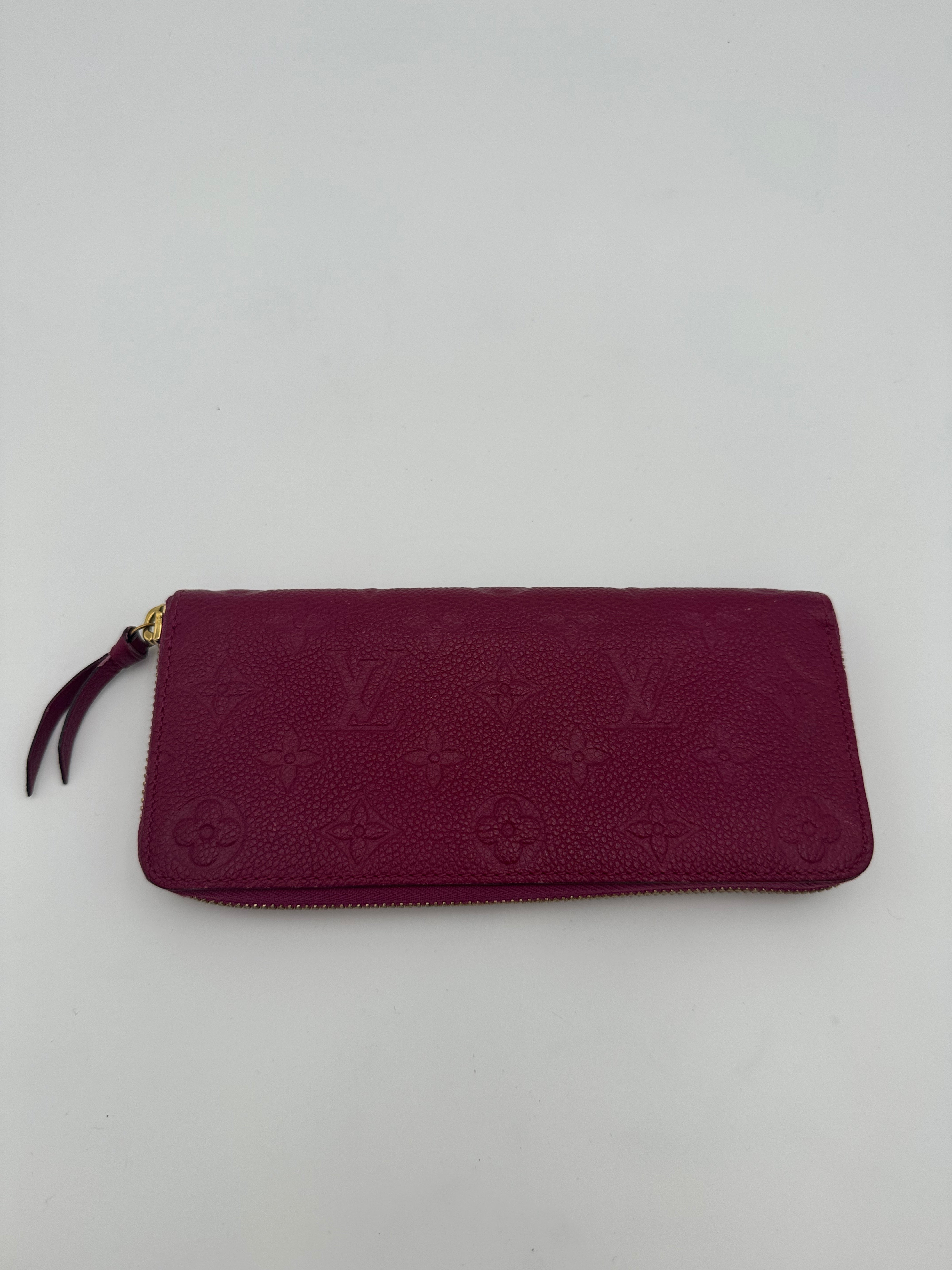 10299 Authentic Pre-loved Louis Vuitton
Clemence Long Zippy Wallet in Empriente Pink Leather