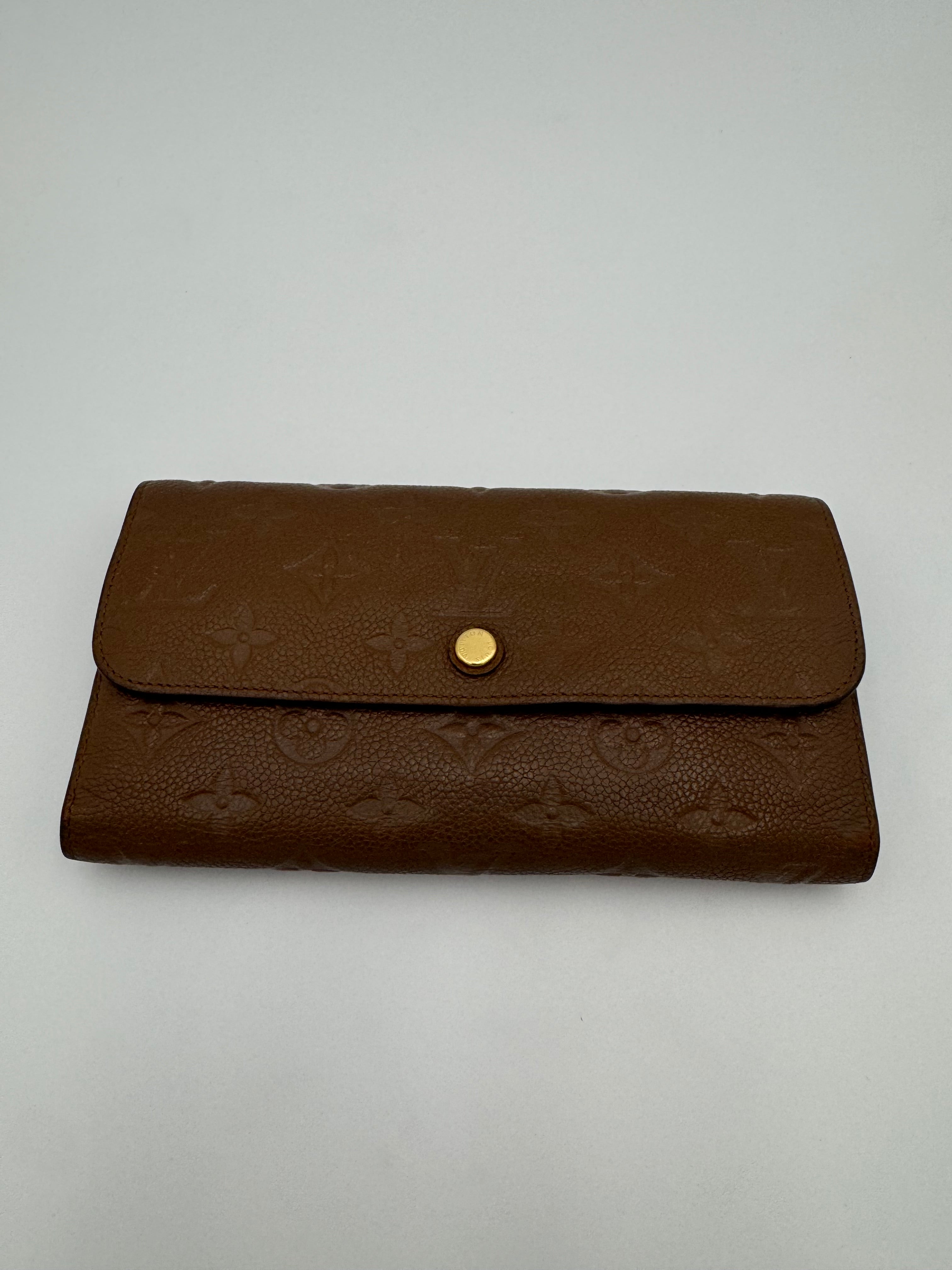 10304 Authentic Pre-loved Louis Vuitton
Trifold Wallet
in Brown Empriente Leather