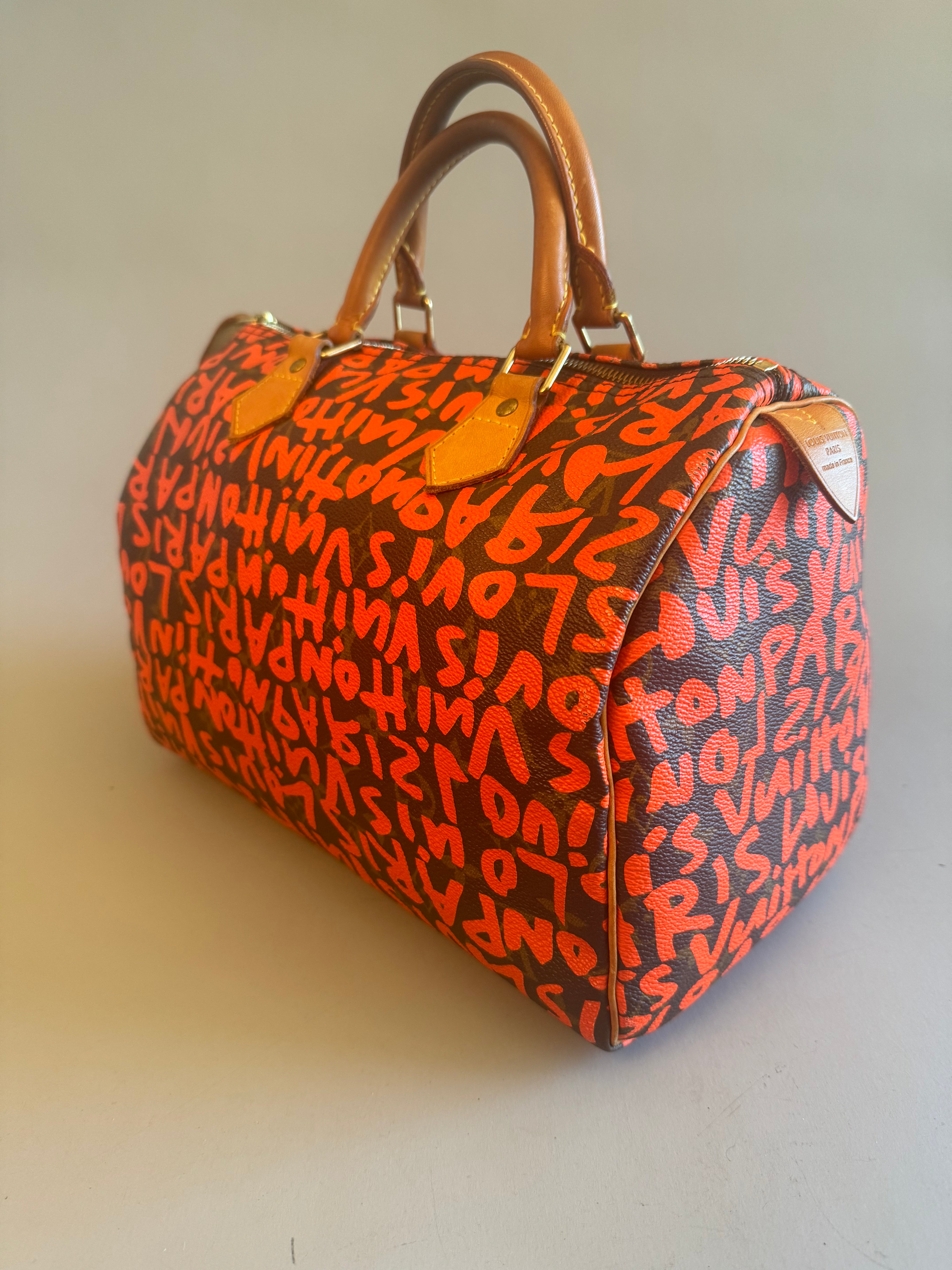 10067 Authentic Pre-loved Louis Vuitton Speedy 30 in Orange Graffiti Monogram canvas