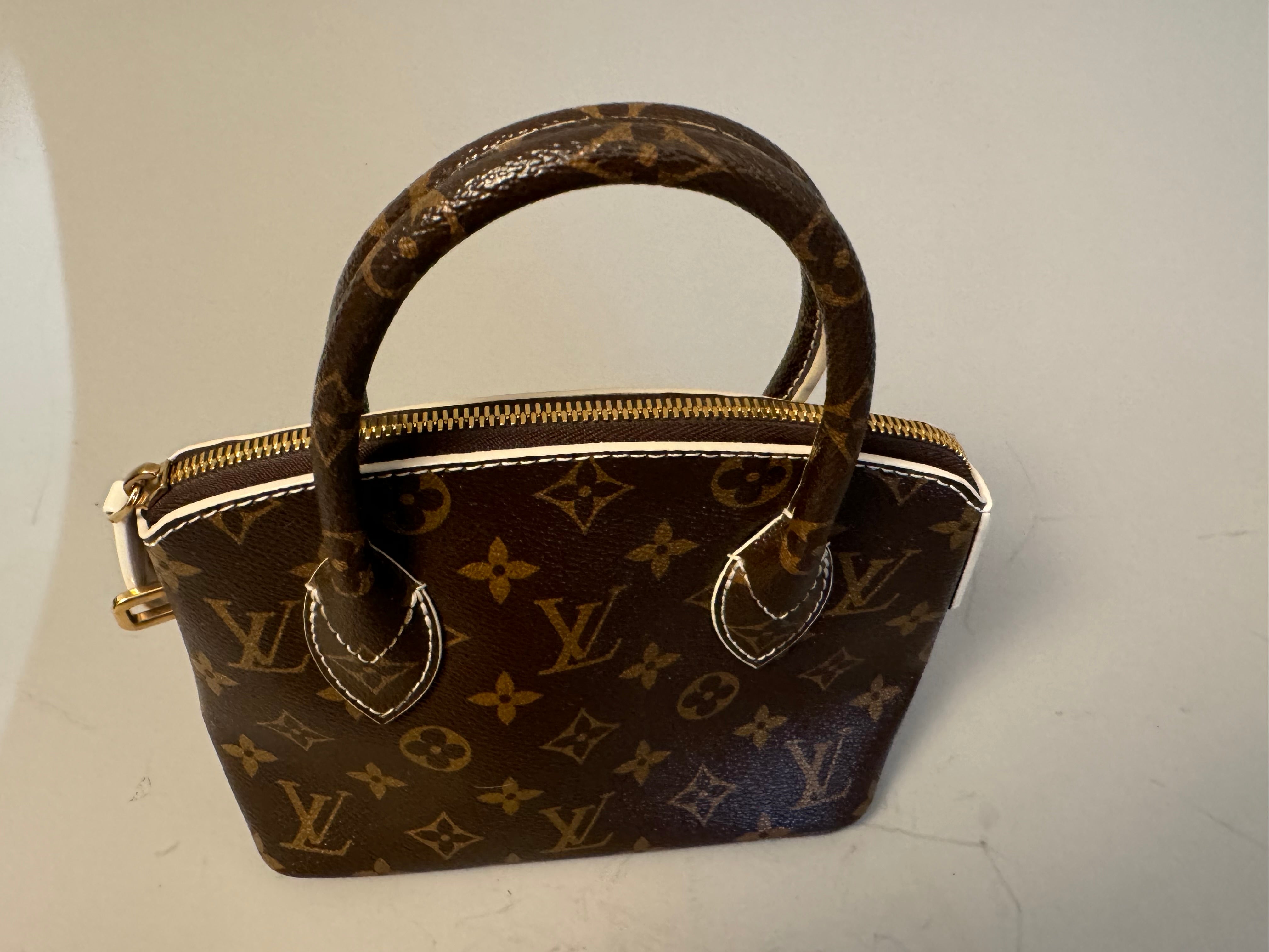 10243 Authentic Pre-loved Louis Vuitton Lock It BB in Monogram Canvas