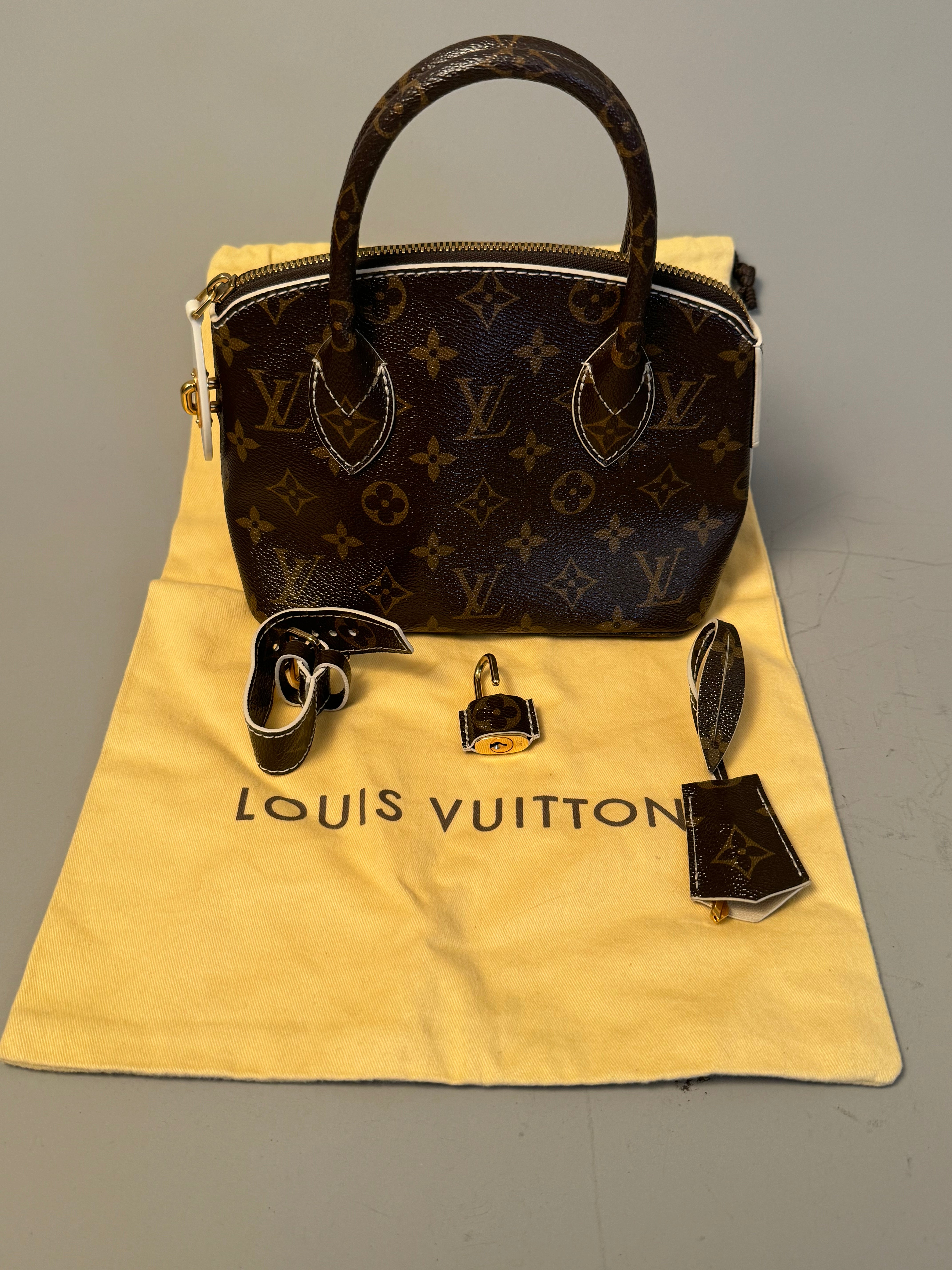 10243 Authentic Pre-loved Louis Vuitton Lock It BB in Monogram Canvas