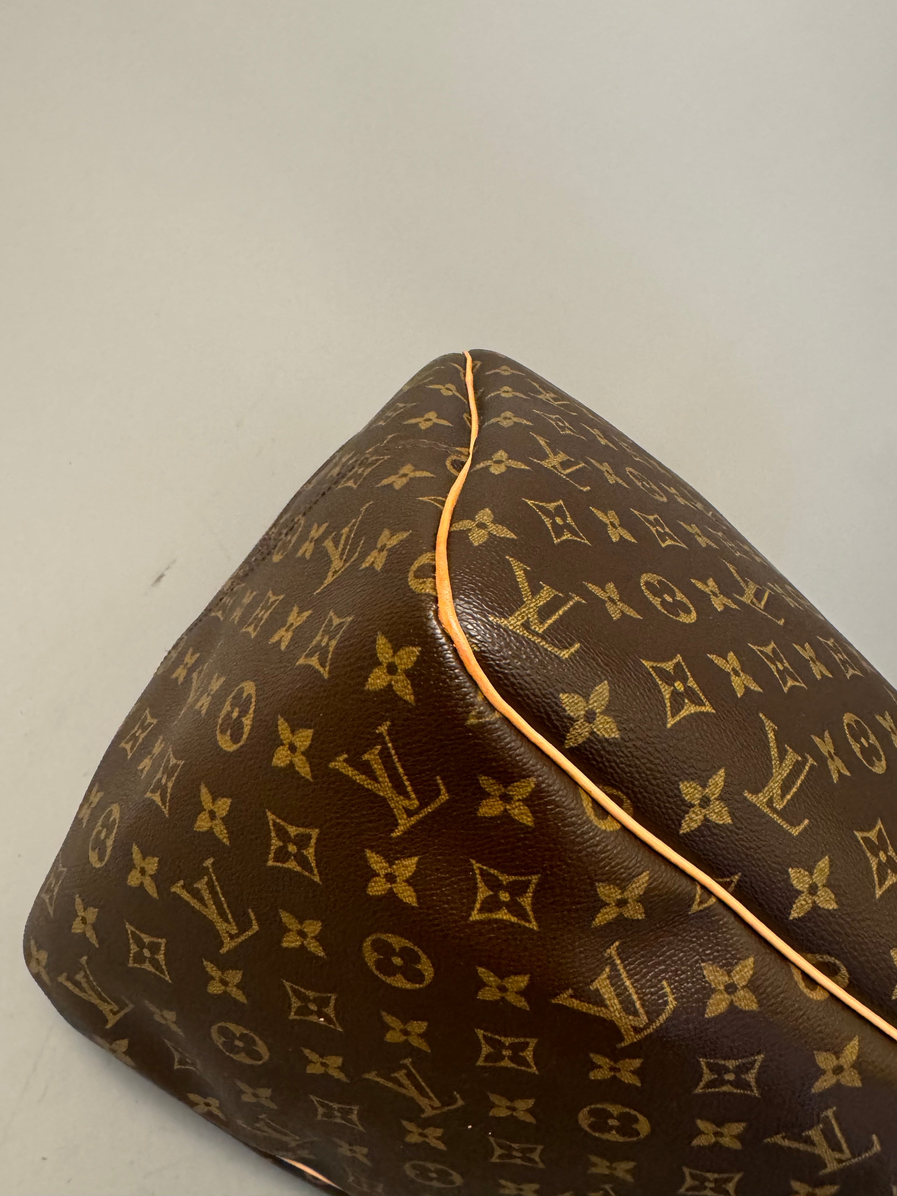 10164 Authentic Pre-loved Louis Vuitton Evasion in Monogram Canvas