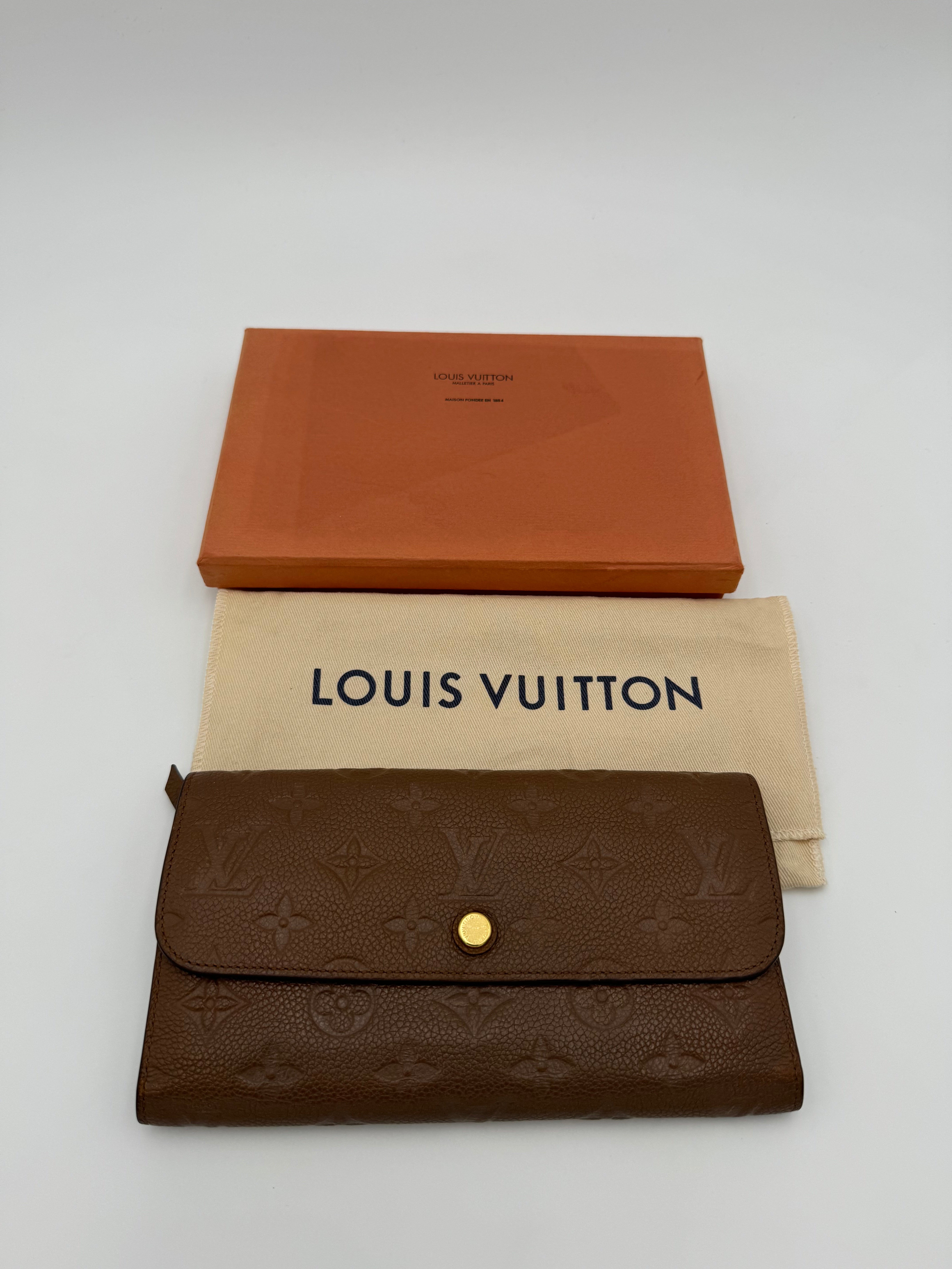 10304 Authentic Pre-loved Louis Vuitton
Trifold Wallet
in Brown Empriente Leather