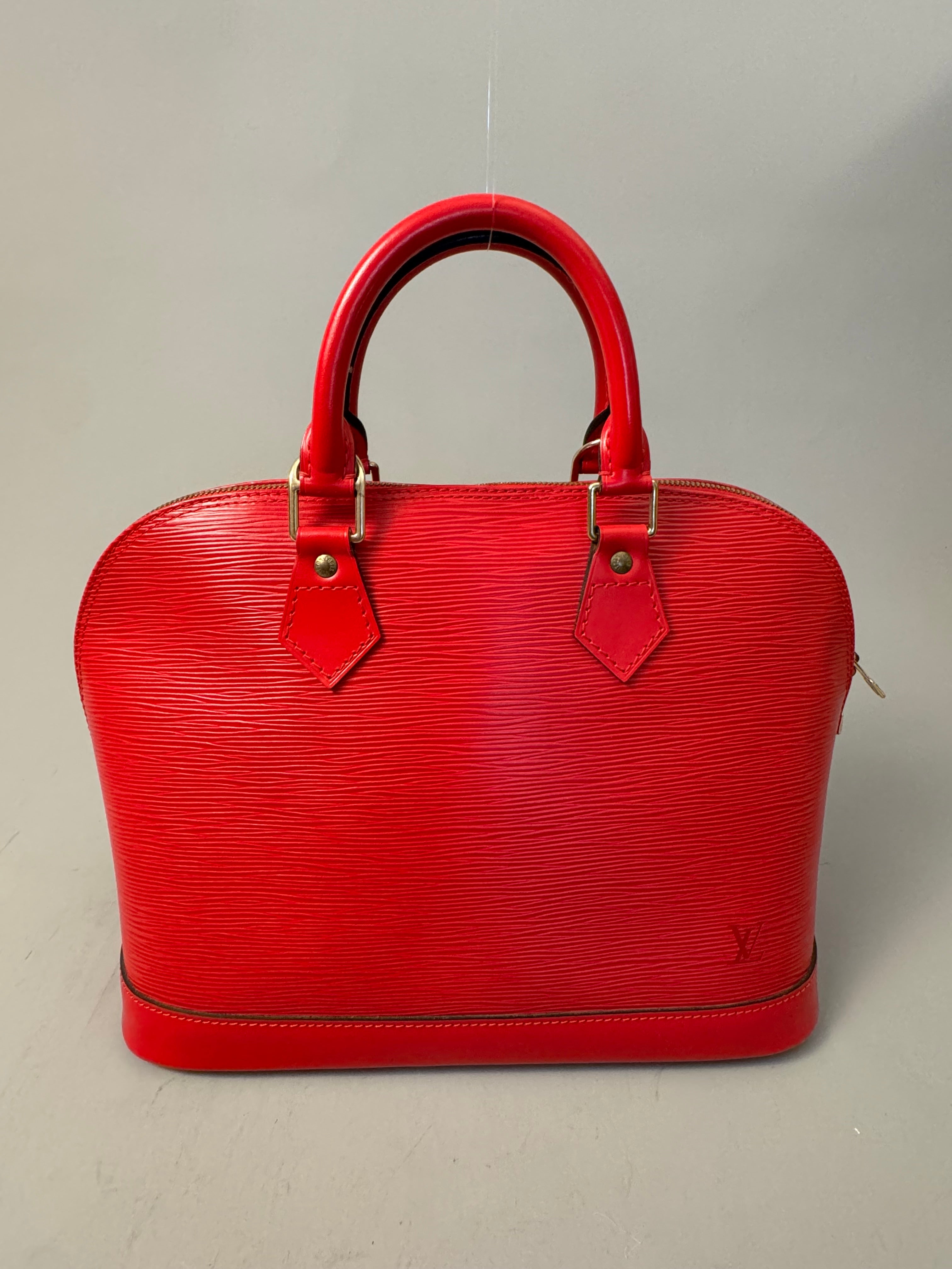 10263 Authentic Pre-loved Louis Vuitton
Alma in Red Epi Leather