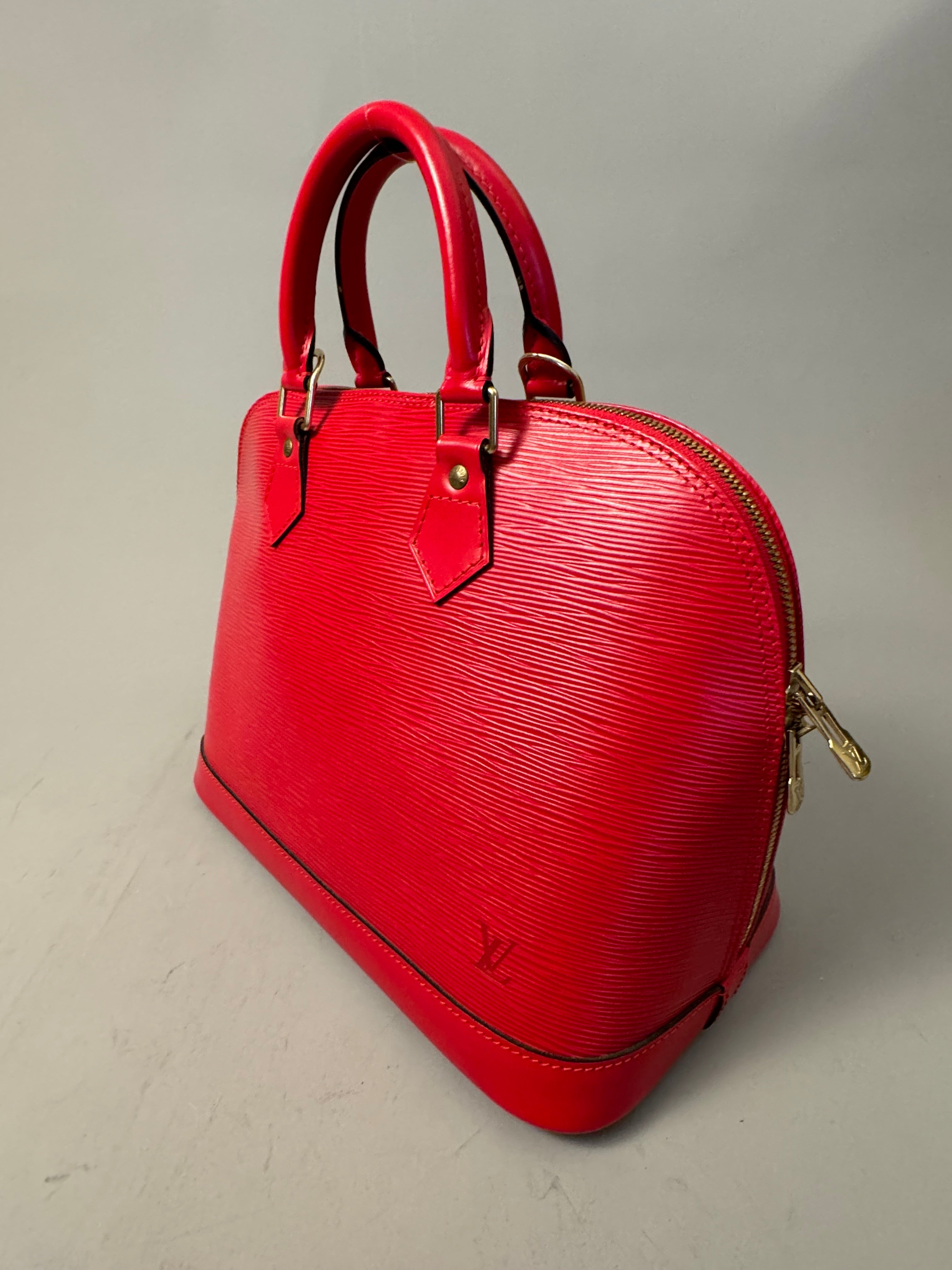 10263 Authentic Pre-loved Louis Vuitton
Alma in Red Epi Leather