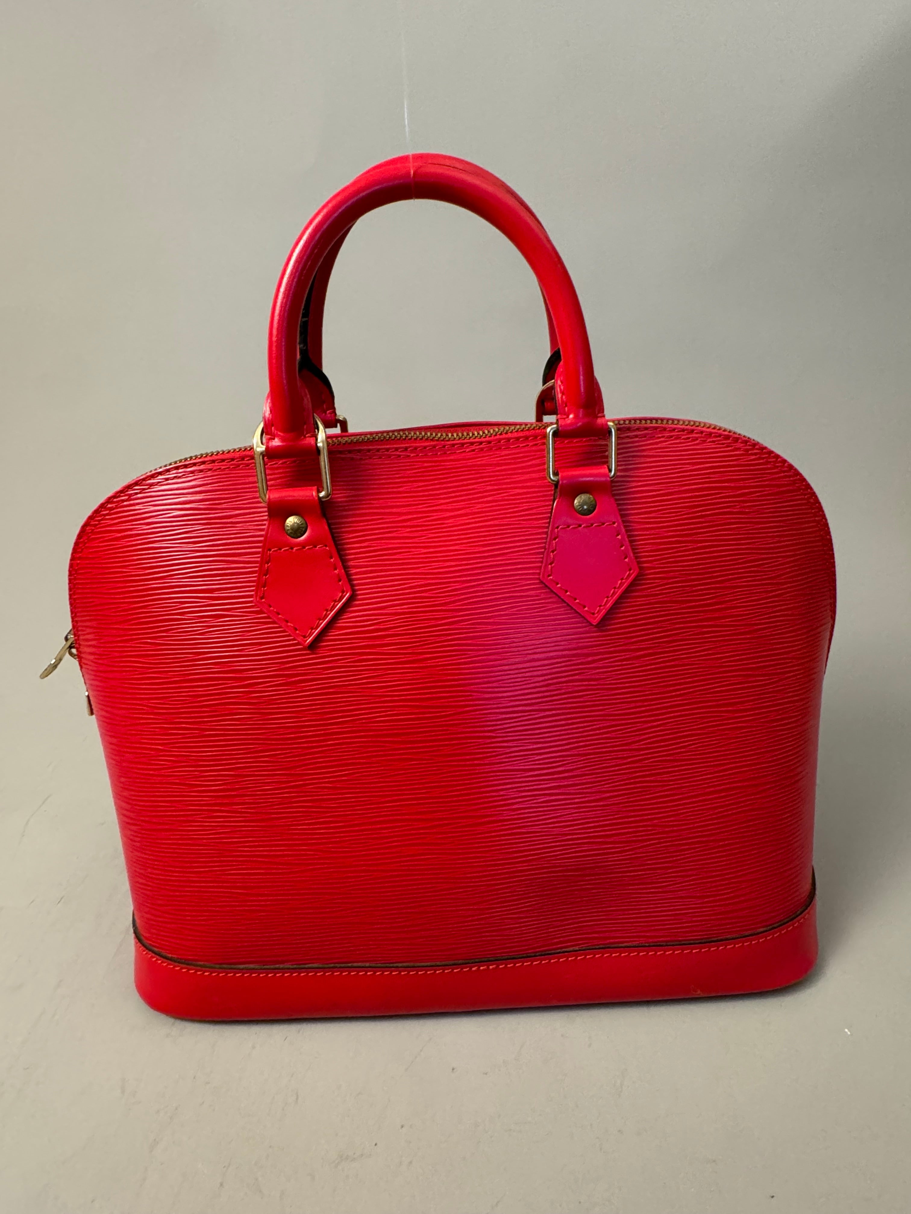 10263 Authentic Pre-loved Louis Vuitton
Alma in Red Epi Leather