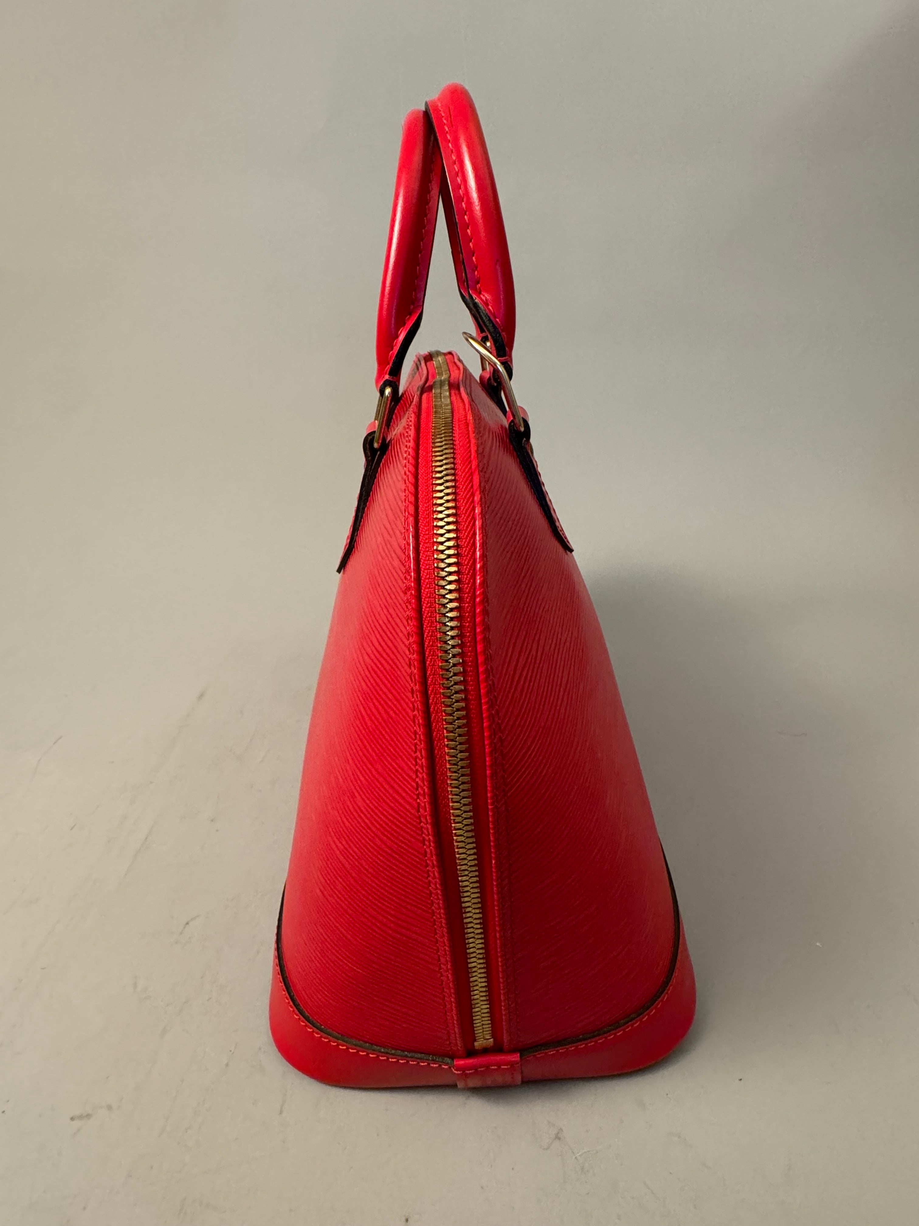 10263 Authentic Pre-loved Louis Vuitton
Alma in Red Epi Leather