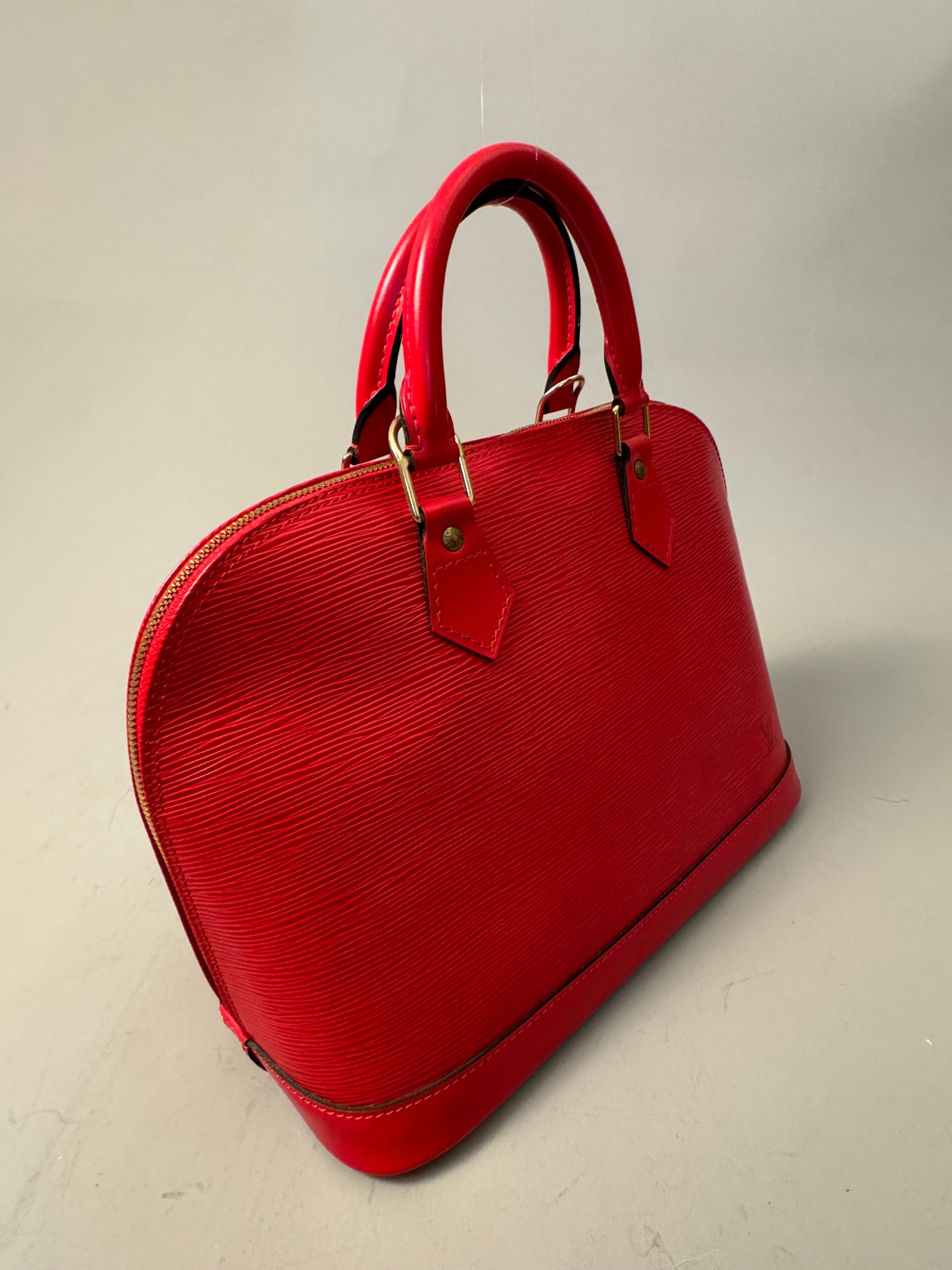 10263 Authentic Pre-loved Louis Vuitton
Alma in Red Epi Leather