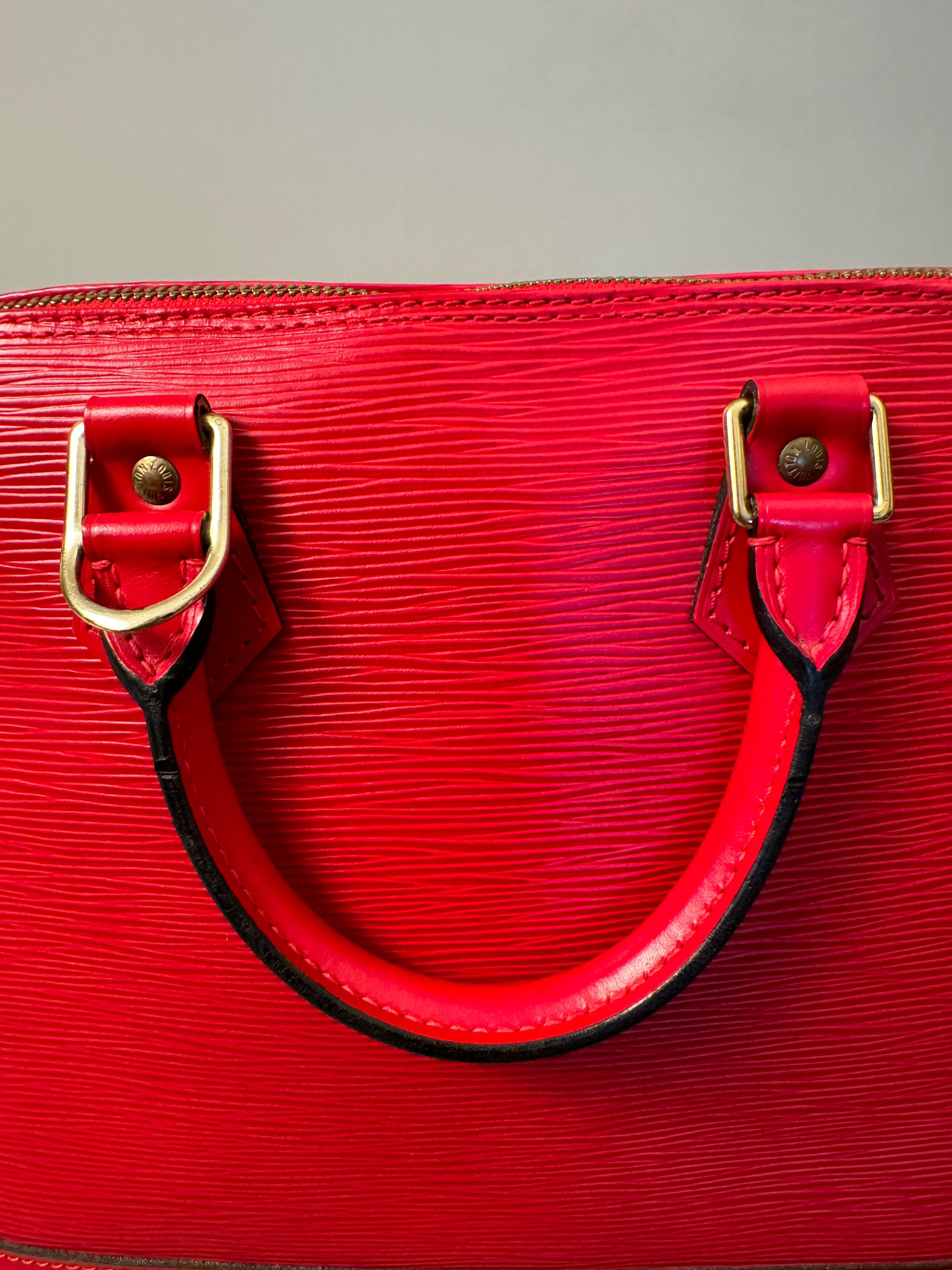 10263 Authentic Pre-loved Louis Vuitton
Alma in Red Epi Leather